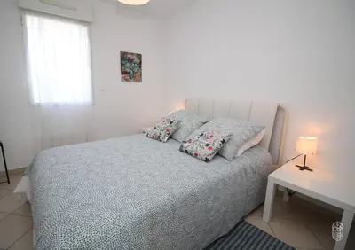 Un ou plusieurs lits dans un hébergement de l'établissement Appartement vue mer et montagnes