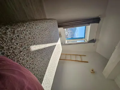 Un ou plusieurs lits dans un hébergement de l'établissement Appartement sur le port