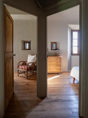 Un ou plusieurs lits dans un hébergement de l'établissement A Casa di U Scogliu Maison les pieds dans l eau Cap Corse