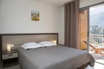 Un ou plusieurs lits dans un hébergement de l'établissement Résidence Hotelière Capu Seninu