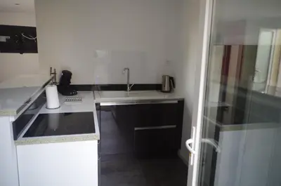 Cuisine ou kitchenette dans l'établissement Studio entre mer et montagne