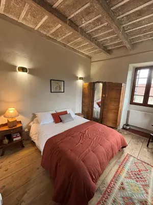 Un ou plusieurs lits dans un hébergement de l'établissement Maison de Caractère au coeur du village