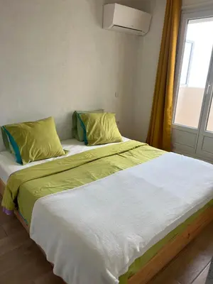 Un ou plusieurs lits dans un hébergement de l'établissement Très bel appartement