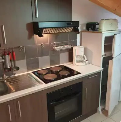 Cuisine ou kitchenette dans l'établissement Appartement Paglia Orba Rivière & maquis