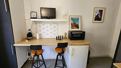 Cuisine ou kitchenette dans l'établissement Studio Gare Corte