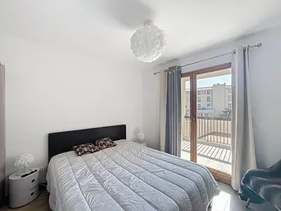 Un ou plusieurs lits dans un hébergement de l'établissement Armonia - Appartement en centre-ville