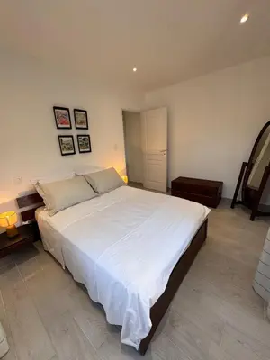 Un ou plusieurs lits dans un hébergement de l'établissement Appartement au cœur du village