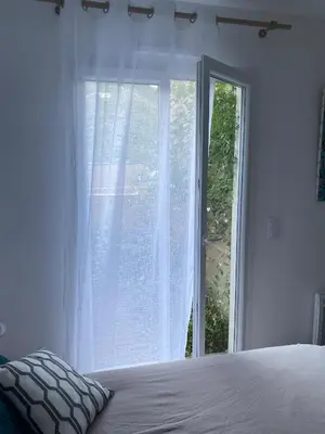 Un ou plusieurs lits dans un hébergement de l'établissement T2 Farinole vue mer golfe de St Florent plage à pied