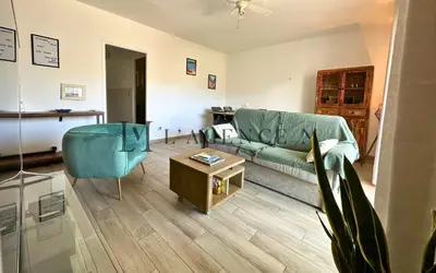 Coin salon dans l'établissement Appartement Colomba