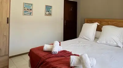 Un ou plusieurs lits dans un hébergement de l'établissement Les Chambres de Giottani