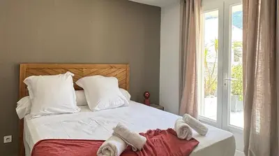 Un ou plusieurs lits dans un hébergement de l'établissement Les Chambres de Giottani