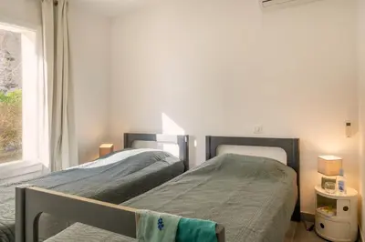 Un ou plusieurs lits dans un hébergement de l'établissement Villa ODETTE