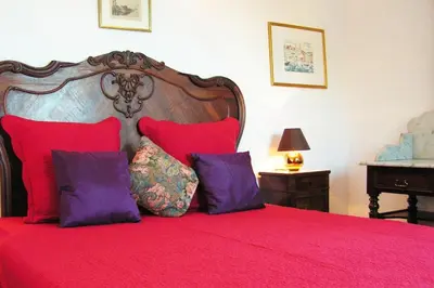 Un ou plusieurs lits dans un hébergement de l'établissement Maison de caractère spacieuse et confortable, grand jardin , superbes vues