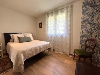 Un ou plusieurs lits dans un hébergement de l'établissement FURIANI Appartement avec Piscine dans Villa