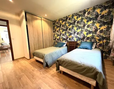 Un ou plusieurs lits dans un hébergement de l'établissement FURIANI Appartement avec Piscine dans Villa
