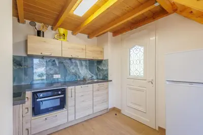 Cuisine ou kitchenette dans l'établissement A Cupulatta - proche des plages