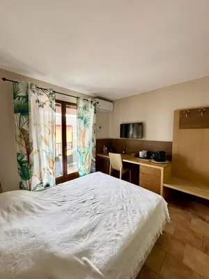 Un ou plusieurs lits dans un hébergement de l'établissement Studio dans résidence avec piscine à Sisco