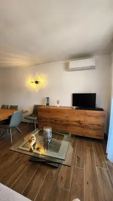 Télévision ou salle de divertissement dans l'établissement Duplex Horizon Bleu