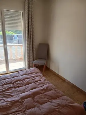 Un ou plusieurs lits dans un hébergement de l'établissement Chez Rachel chambre et salle bain privative chez l'habitant