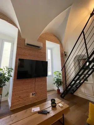 Télévision ou salle de divertissement dans l'établissement Nid douillet - maison Spinola
