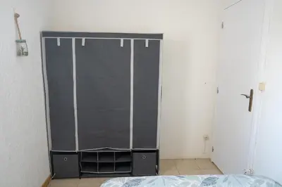 Un ou plusieurs lits dans un hébergement de l'établissement maison climatisée fibrée 2 chambres à 9 min à pieds d'une grande plage