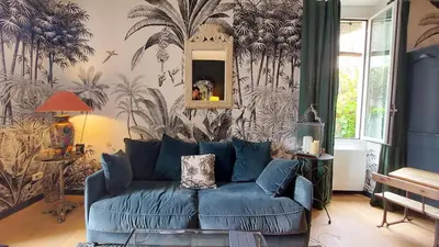 Coin salon dans l'établissement Appartement dans villa avec jardin privatif