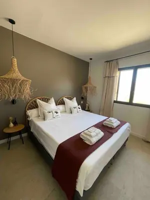Un ou plusieurs lits dans un hébergement de l'établissement La Villa Geneviève, Maison 6 personnes avec piscine
