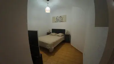 Un ou plusieurs lits dans un hébergement de l'établissement Appartement Spacieux Vue Montagne- Parking gratuit- Proche ÎLE ROUSSE