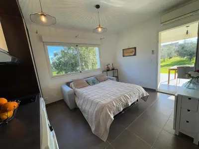 Un ou plusieurs lits dans un hébergement de l'établissement Maison à 2 minutes de la mer en voiture
