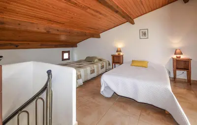 Un ou plusieurs lits dans un hébergement de l'établissement Maison Residence Piscine