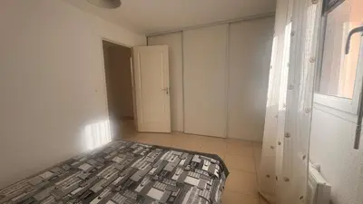 Un ou plusieurs lits dans un hébergement de l'établissement Appart 2 Chambres Charley super emplacement et parking
