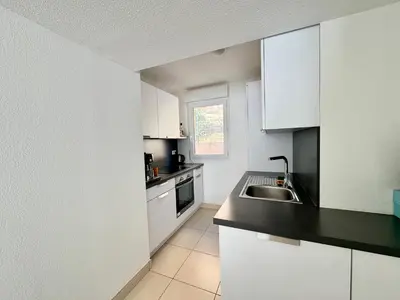Cuisine ou kitchenette dans l'établissement Appart 2 Chambres Charley super emplacement et parking