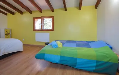 Un ou plusieurs lits dans un hébergement de l'établissement Grande Villa Piscine