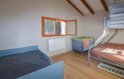 Un ou plusieurs lits dans un hébergement de l'établissement Grande Villa Piscine