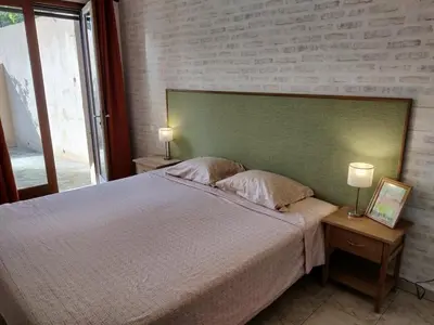 Un ou plusieurs lits dans un hébergement de l'établissement Holiday apartment in Lumio with swimming pool