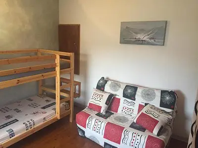 Un ou plusieurs lits dans un hébergement de l'établissement Pavillon au bord de la mer