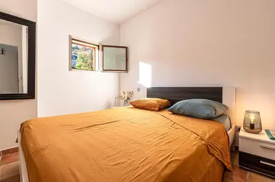 Un ou plusieurs lits dans un hébergement de l'établissement L'Appartement Cinto - Proche de L'île Rousse