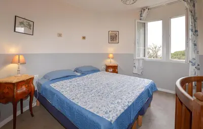 Un ou plusieurs lits dans un hébergement de l'établissement Belle Maison Au Bord De La Mer