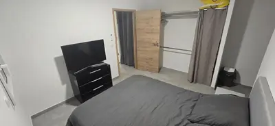 Un ou plusieurs lits dans un hébergement de l'établissement Appartement neuf 4 personnes RDC villa