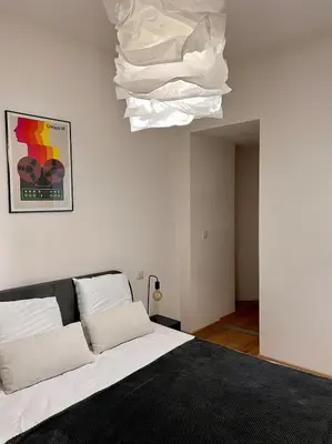 Un ou plusieurs lits dans un hébergement de l'établissement Village centre appartement