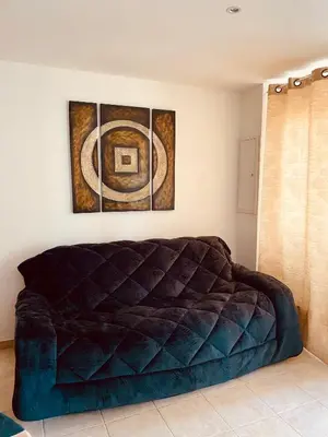 Coin salon dans l'établissement Charmant T2 en rez-de-jardin