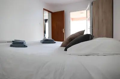 Un ou plusieurs lits dans un hébergement de l'établissement Appartement entre mer et montagne