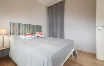 Un ou plusieurs lits dans un hébergement de l'établissement Villa Piscine Privative