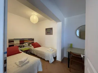 Un ou plusieurs lits dans un hébergement de l'établissement T3 de 80m2 avec piscine - jardin - vue mer