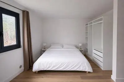 Un ou plusieurs lits dans un hébergement de l'établissement Studio climatisé avec terrasse privative