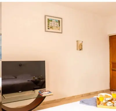 Télévision ou salle de divertissement dans l'établissement Villa Emmanuella