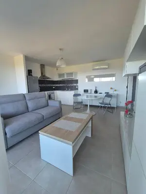 Cuisine ou kitchenette dans l'établissement T2 vue mer