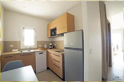 Cuisine ou kitchenette dans l'établissement Résidence Roc e Mare