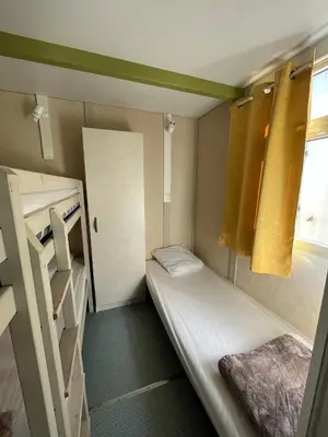 Un ou plusieurs lits dans un hébergement de l'établissement Le Camping de la Plage