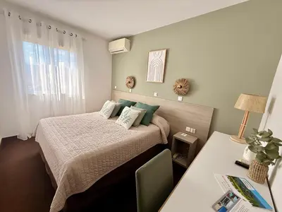 Un ou plusieurs lits dans un hébergement de l'établissement Hôtel Restaurant L' Empereur